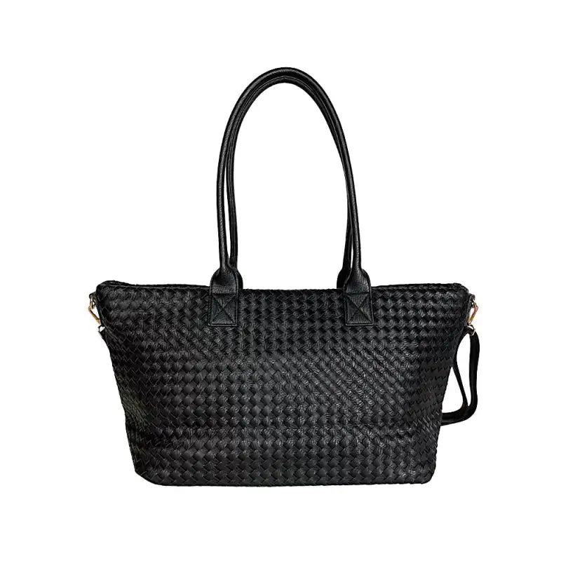 Vista traseira da bolsa shopper preta em tressê evidenciando o design contínuo e elegante.