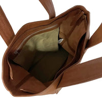 Interior da bolsa shopper sem forro, destacando o bolso suspenso com zíper para celular e chaves.