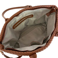 Vista interna da bolsa shopper caramelo com forro reforçado e divisórias de saque rápido.
