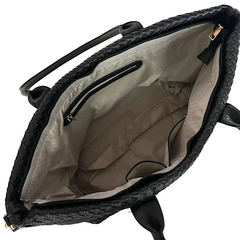 Interior forrado da bolsa shopper mostrando o bolso com zíper e compartimentos para celular.