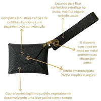 Carteira de pulso em couro preto e ferragem ouro velho, descritiva detalhada